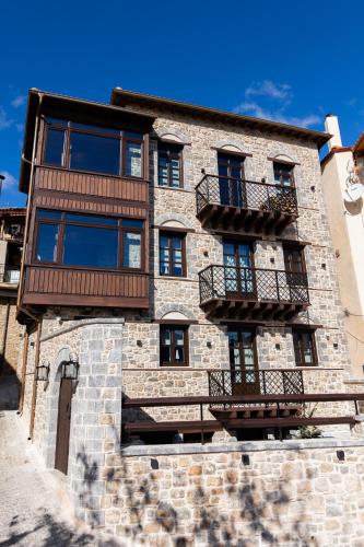 a building with balconies on the side of it at Maison Michelangelo in Arachova