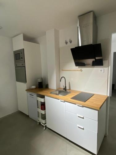 a kitchen with a sink and a counter top at Smart Residencial in Villanueva de la Cañada