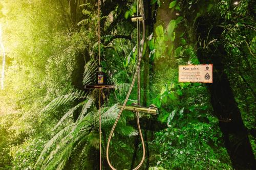 a shower in the jungle with a sign on it at Rioca Frankfurt Posto 7 in Frankfurt