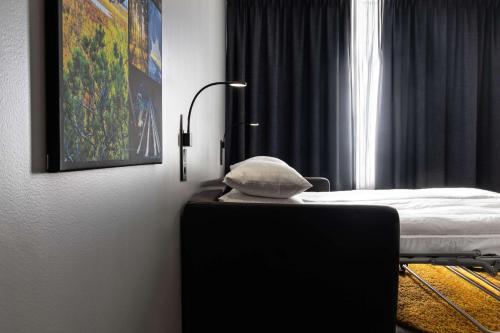 a hospital room with a bed and a window at Best Western Hotel Arctic Eden in Kiruna