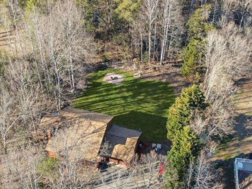 an overhead view of a house in the woods at Cozy and Comfy with Lake Access in Mineral