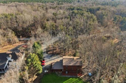an overhead view of a house in the woods at Cozy and Comfy with Lake Access in Mineral
