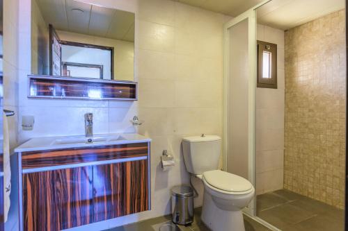a bathroom with a toilet and a sink at Villagio Resort in Zaarour in Zaarour