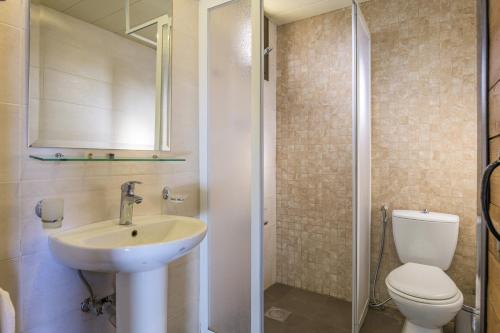 a bathroom with a sink and a toilet and a shower at Villagio Resort in Zaarour in Zaarour