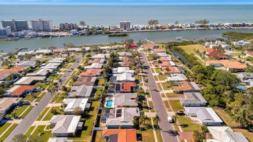 an aerial view of houses next to the water at The Crown House 4b Pool Home 6 mins to IR Beach in Largo