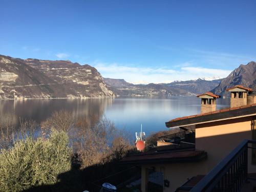 a view of a large body of water with mountains at Appartamento Bella Isola in Monte Isola