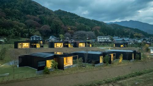 an aerial view of a house in the mountains at 歓宿縁 eshikoto in Eiheiji