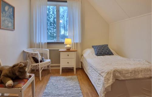 a small bedroom with a bed and a chair at Pet Friendly Home In Vara With Wifi in Vara