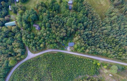 an overhead view of a road in the forest at Cozy Home In Strömsnäsbruk With Wifi in Strömsnäsbruk