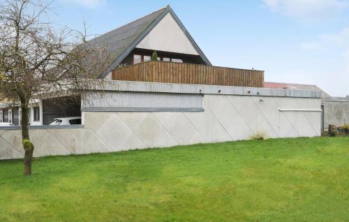 a large white building with a roof on top of a yard at Gorgeous Apartment In Bording With Wifi in Engesvang