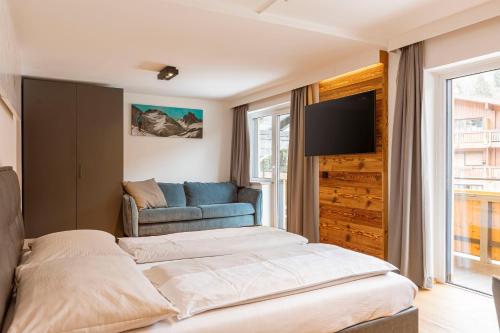 Postel nebo postele na pokoji v ubytování Saalbach Suites by ALPS RESORTS