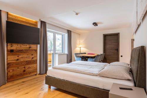Postel nebo postele na pokoji v ubytování Saalbach Suites by ALPS RESORTS