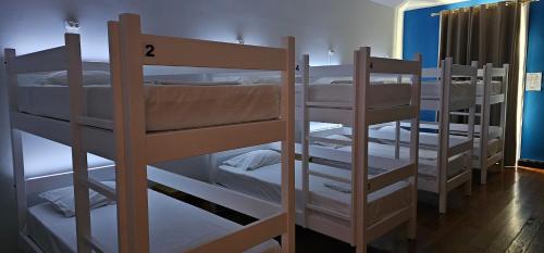 a group of bunk beds in a room at Santa Maria Hostel in Funchal