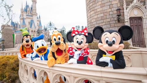 a group of mickey mouse figurines in front of disney at Dayin Youth Hostel - East Nanjing Road & People's Square & The Bund -Large Social Area -Bar -Café -Gym -Free Laundry Luggage Storage -24H Front Desk -English Service in Shanghai