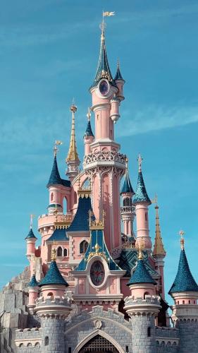 a large castle building with a clock tower at Dayin Garden Hotel -People's Square & Nanjing Road-Large Social Area -Bar -Café -Gym -Free Laundry Luggage Storage -24H Front Desk-English Service in Shanghai