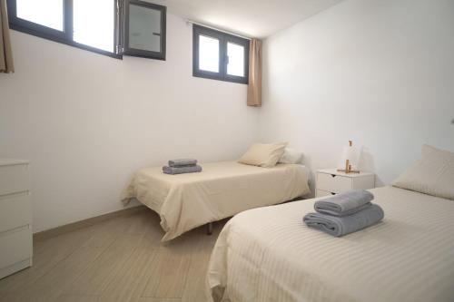 Posteľ alebo postele v izbe v ubytovaní Bungalow con vistas al mar