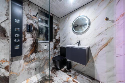 a bathroom with a sink and a mirror at MyNites in Birmingham