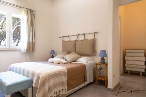 Una cama o camas en una habitación de Dimora La Fiumara
