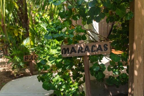 a sign that says marazas in front of a plant at Casa Mariposa Beach Hotel in Tierra Blanca