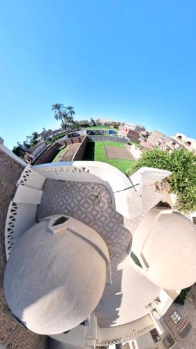 an aerial view of a building with a dome at Sunset Haven Guesthouse in Luxor
