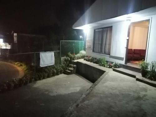 a house lit up at night with a window at Lakleen holiday home in Nuwara Eliya
