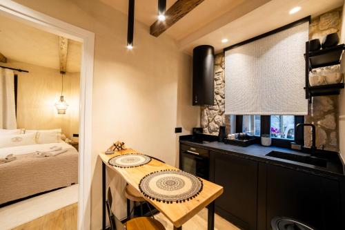 a small kitchen with a table in a room at Maison Michelangelo in Arachova
