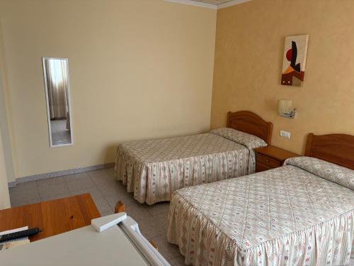Ένα ή περισσότερα κρεβάτια σε δωμάτιο στο Hotel jendri