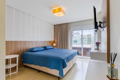 Ένα ή περισσότερα κρεβάτια σε δωμάτιο στο Cobertura Espetacular com Jacuzzi Privativa - Boulevard Bombinhas