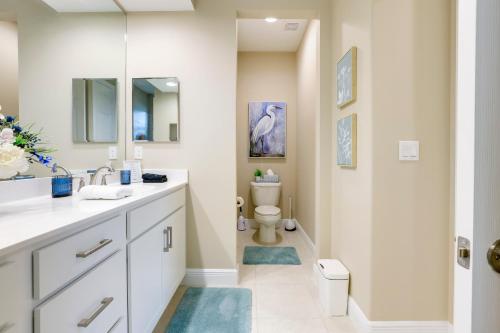 a bathroom with a sink and a toilet at Stylish Port St Lucie Home with Hot Tub and Game Room! in Walton