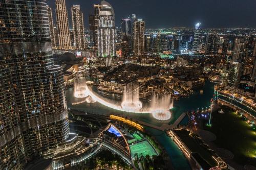 a view of a city at night with buildings at Address Residence Opera, Downtown, Dubai in Dubai