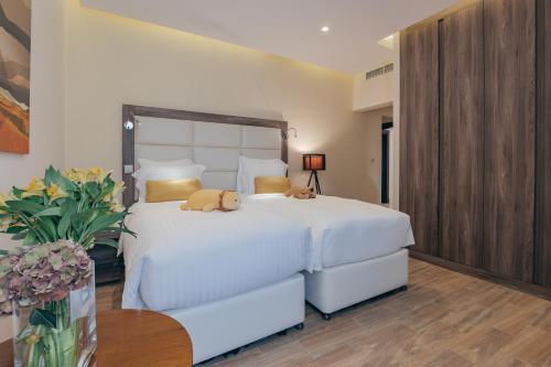 Un ou plusieurs lits dans un hébergement de l'établissement Simaisma A Murwab Resort