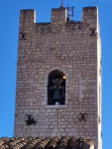a bell tower with a window on top of a building at Aloha in Vence