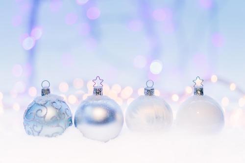 a group of christmas ornaments are lined up at POŁONINY Resort in Bukowiec
