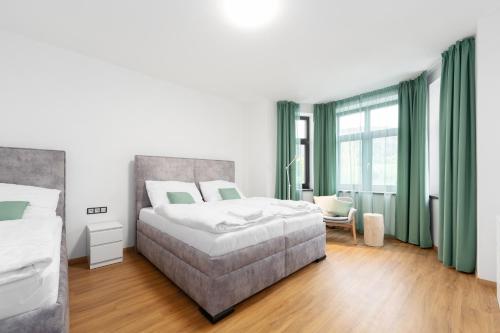 Una cama o camas en una habitación de Objev Jeseníky