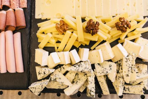 a tray filled with cheese and meats and nuts at Klostergut Kronburg in Zams