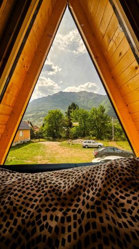 a view from a window of a bed in a tent at Camp Danis in Plav
