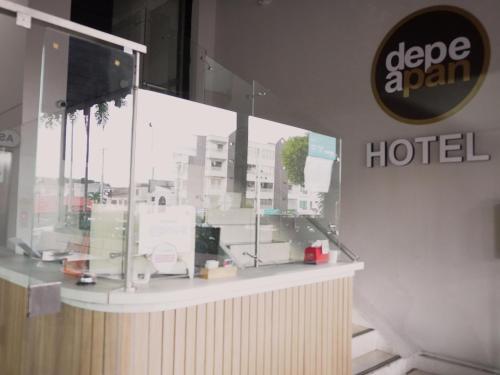 a store front with a window with a hotel at Depeapan in Cali