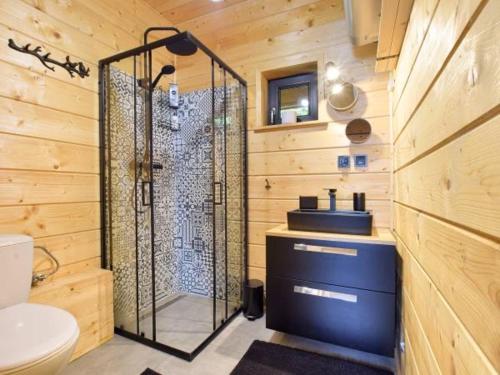 a bathroom with a shower and a sink at Sękata Chata in Szczyrk