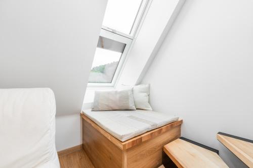 Una cama o camas en una habitación de Objev Jeseníky