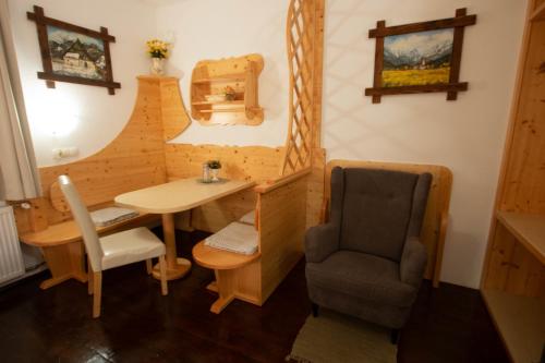 a small room with a chair and a table and a chair at Mama's House in Cerklje na Gorenjskem