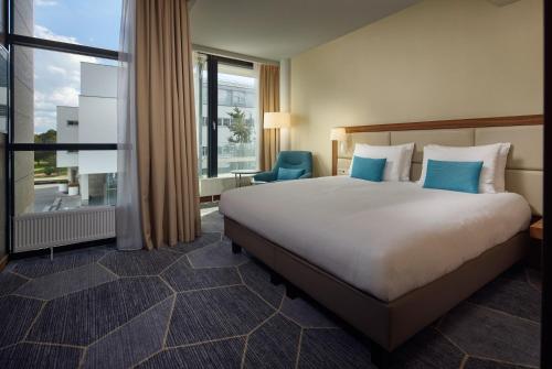 Katil atau katil-katil dalam bilik di Crowne Plaza Maastricht by IHG