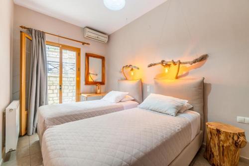 Postel nebo postele na pokoji v ubytování Kefalonia Apt