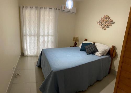 Katil atau katil-katil dalam bilik di Angra dos Reis - Porto Bali - Apartamento no Complexo Mercur