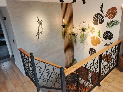 a staircase with a wall with plants on it at Hope Aparta Lofts in Salento