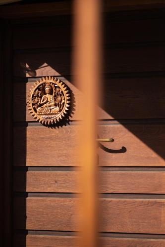a medal on top of a wooden table at Agricampeggio Equinox in Carpignano Sesia