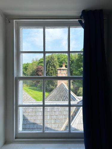 a window with a view of a roof at Estate Of Ord in Muir of Ord