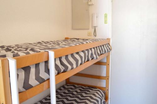a couple of bunk beds in a room at Studio CAP D'AGDE CT121-019 in Cap d'Agde
