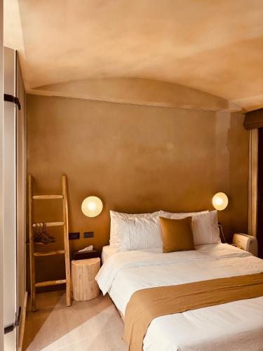a bedroom with a large bed and a brown wall at Jiufen 35 in Jiufen