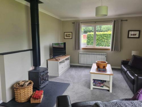 Et opholdsområde på Inveruglas Farm Cottage