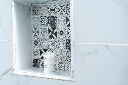 a window in a bathroom with a tile wall at Harry's Kisumu Oasis in Kisumu